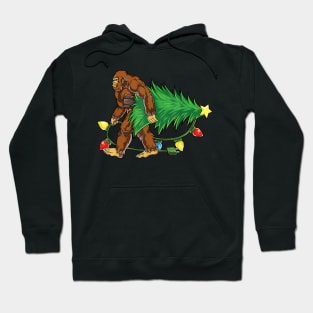 Bigfoot Carrying a Christmas Tree, Funny Sasquatch Gift for Xmas Hoodie